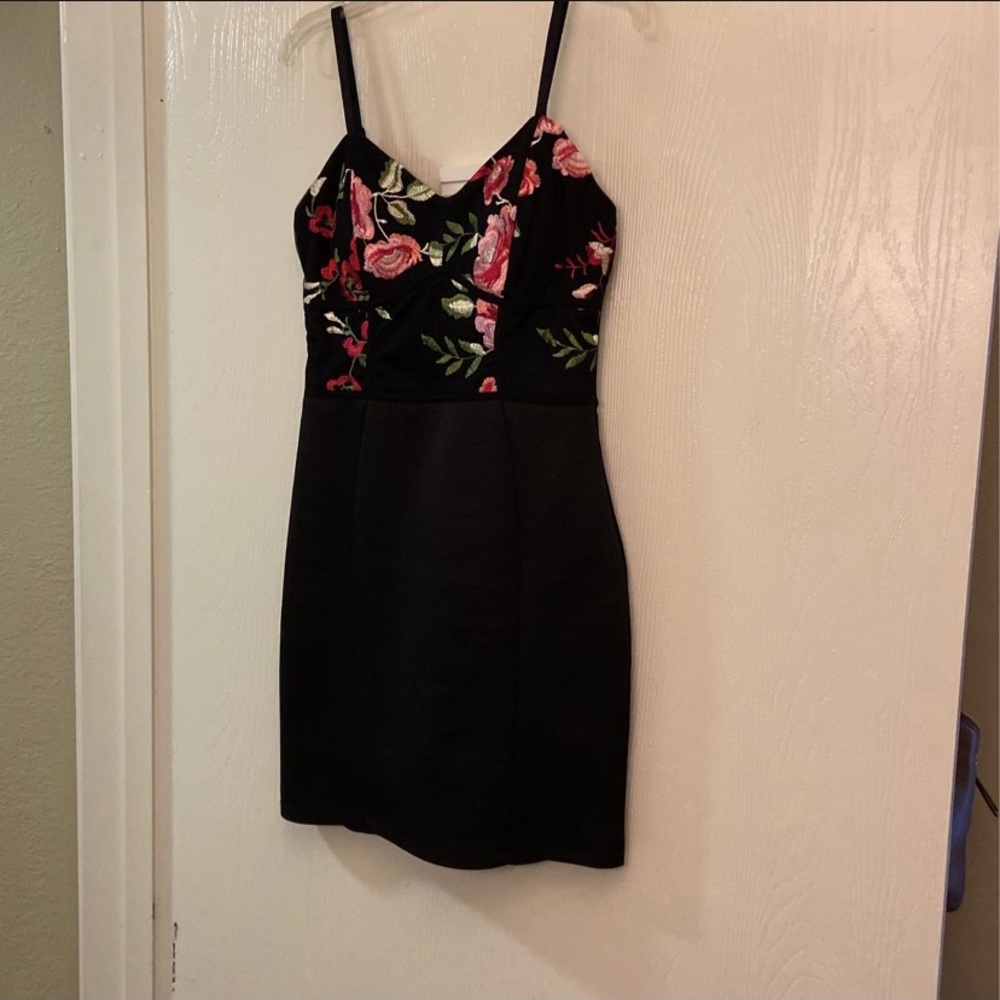 Stretchy black dress with flowers. Only worn once!